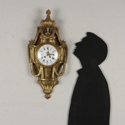 Horloge murale à pendule en bronze