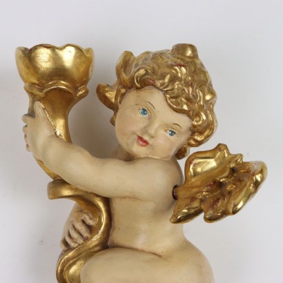 Par de putti de madera tallada