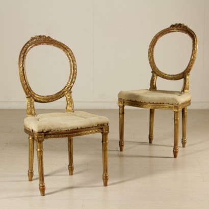 Pair of chairs carved and gilded