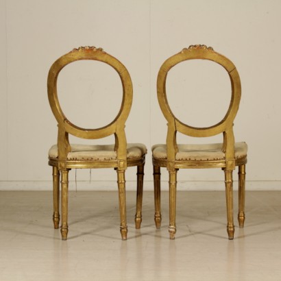 Paire de chaises en bois sculpté et doré sur le dos - repos