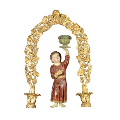 Carved figure with portal frame