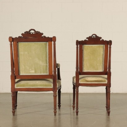 Set of six Carved Chairs and Armchair Italy 20th Century