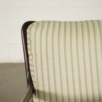 Poltrona nello stile di Paolo Buffa, legno di faggio e noce, cuscino di seduta a molle su cinghie metalliche, schienale in espanso, rivestimento in tessuto. Personalizzabile.