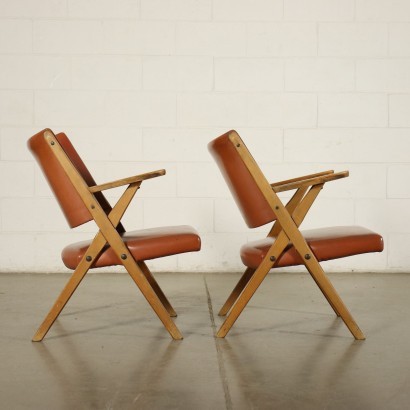 Pair of armchairs, beech wood, foam padding, skai upholstery.